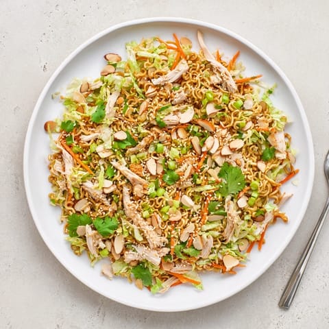 Golden toasted almonds and crushed ramen noodles add texture to this refreshing Crunchy Ramen Chicken Salad, perfect for a quick lunch.