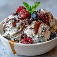 Creamy TikTok Cottage Cheese Ice Cream, a healthy frozen dessert swirled with berries.